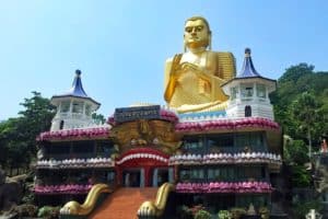 The Golden Buddha statue, Dambulla golden temple, just downhill from the Dambulla Cave temple. A must see for familes and senior travel in Sri Lanka.