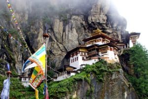 Taktshang Monastery is also known as the Tigers Nest. It clings to a cliff 3,000 feet above the valley floor. A must see in Bhutan tourist attractions.