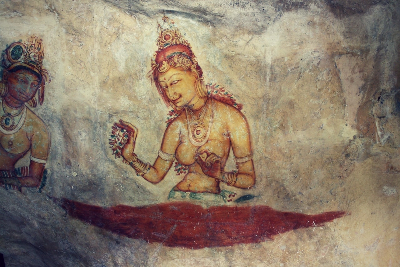 The frescoes in Sigiriya (Lion Rock) shows 500 ladies in varies paintings in an area 140 meters long and 40 meters high. One of the tourist attractions.