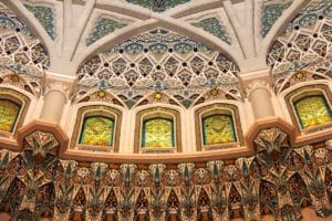 The elegant arches, stained glass windows and mosaics in Sultan Qaboos Grand Mosque in Muscat are breathtaking beauties, a must see on any Oman tour.
